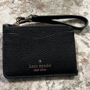 Kate spade key chain card holder 4 cards slot and a opening for cash.